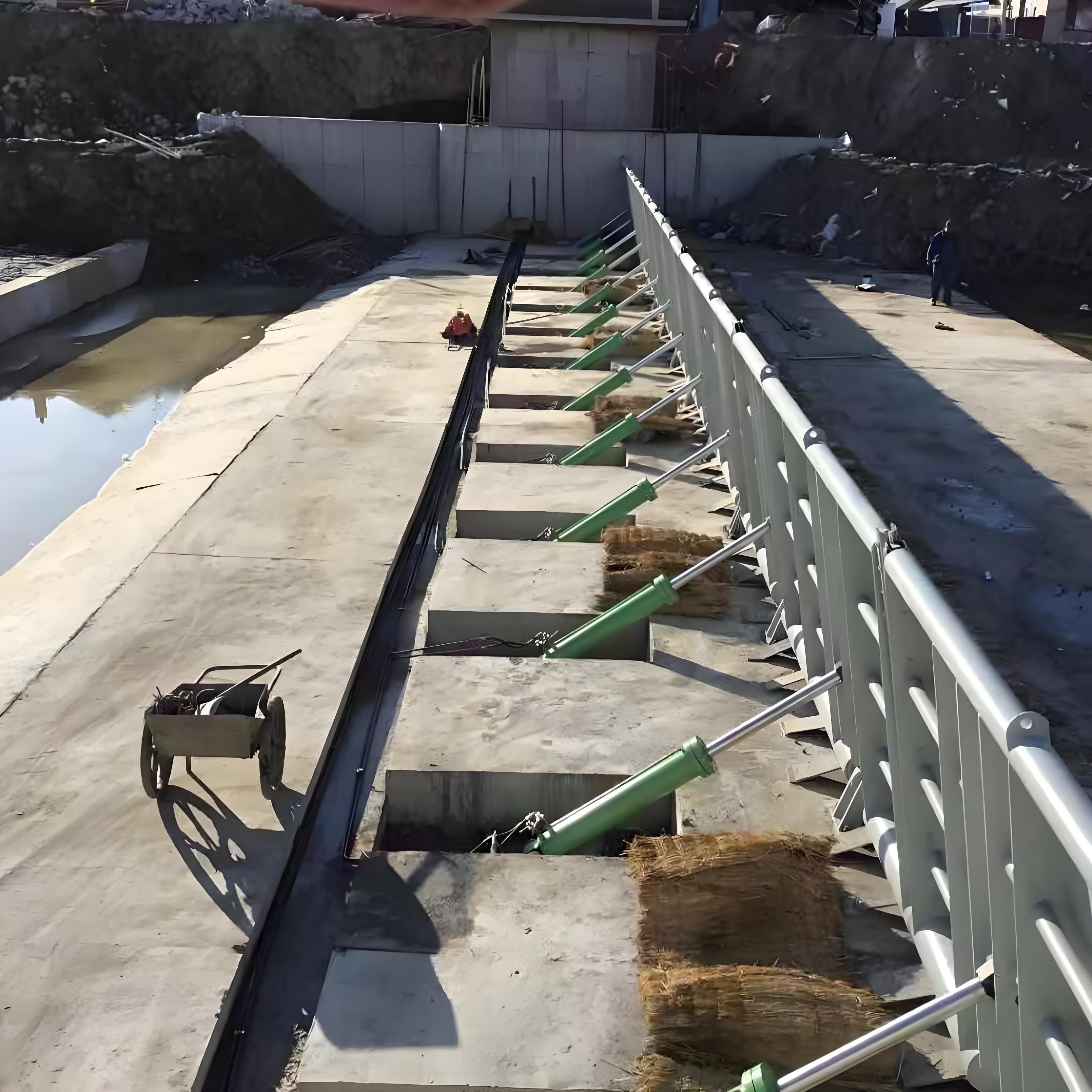 Hydraulic steel dam gate being installed at a construction site